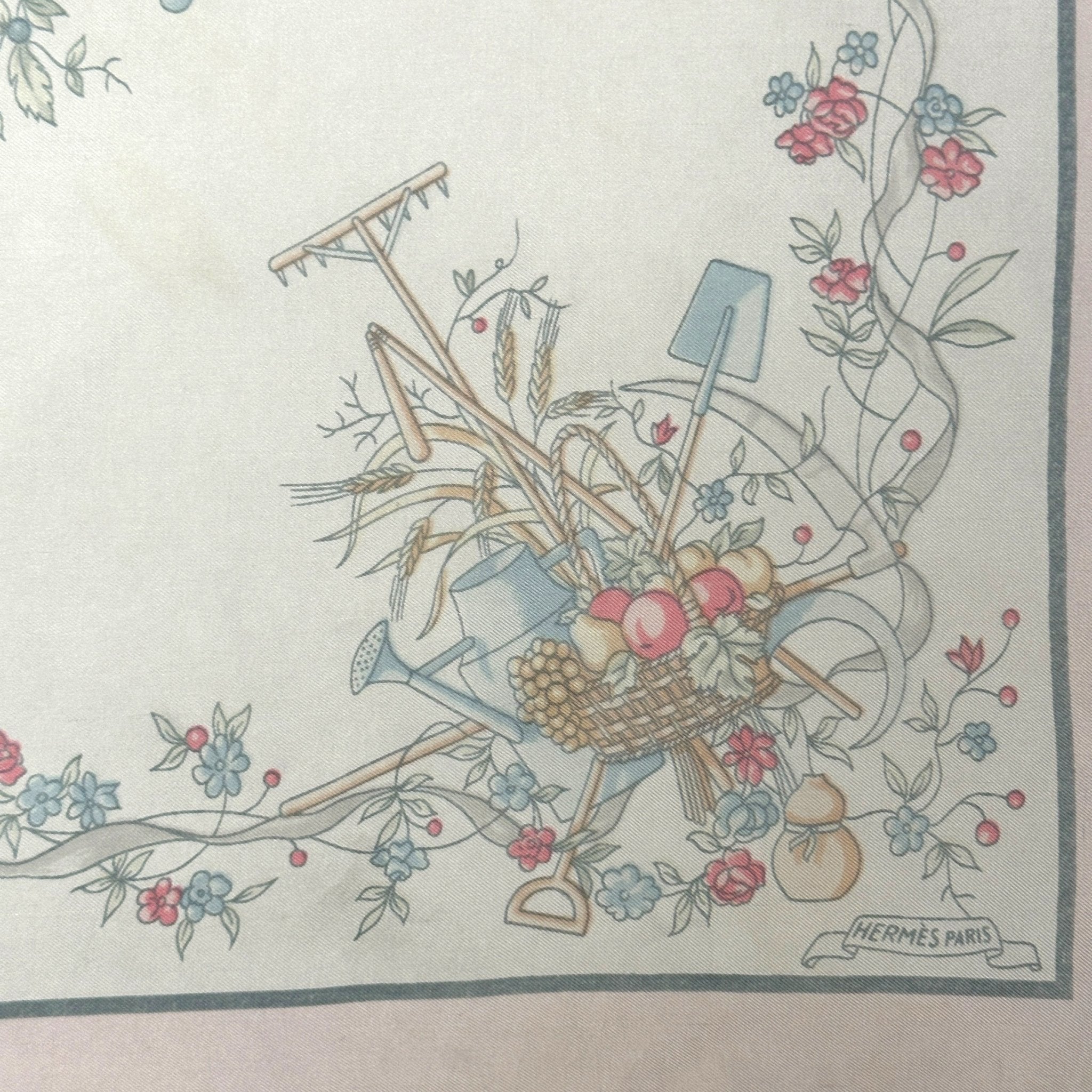 dessin représentant un arrosoir, et des fruits dans une corbeille